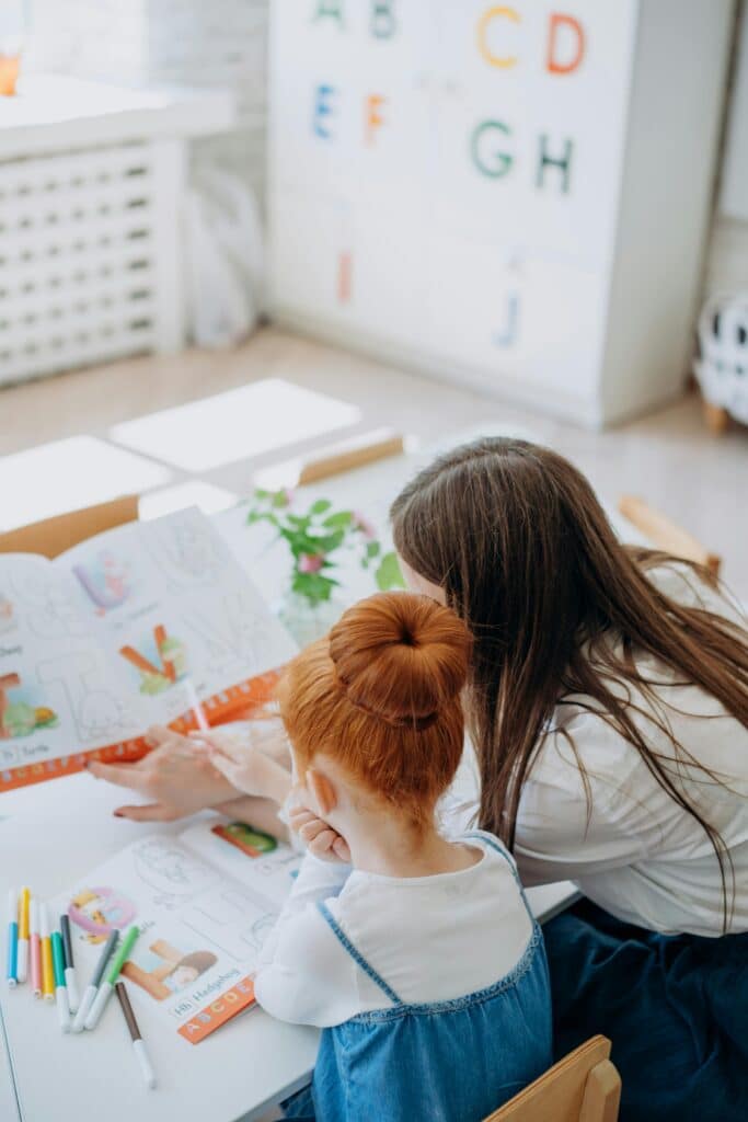 Parent collaborating with child on a school project.